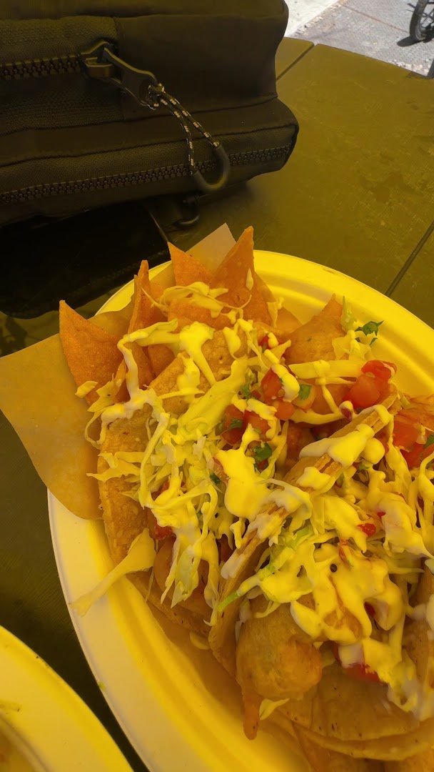 Seafood tacos on a casual restaurant table.